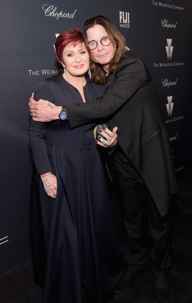 Sharon and Ozzy Osbourne posing together, with Ozzy's arm around Sharon.