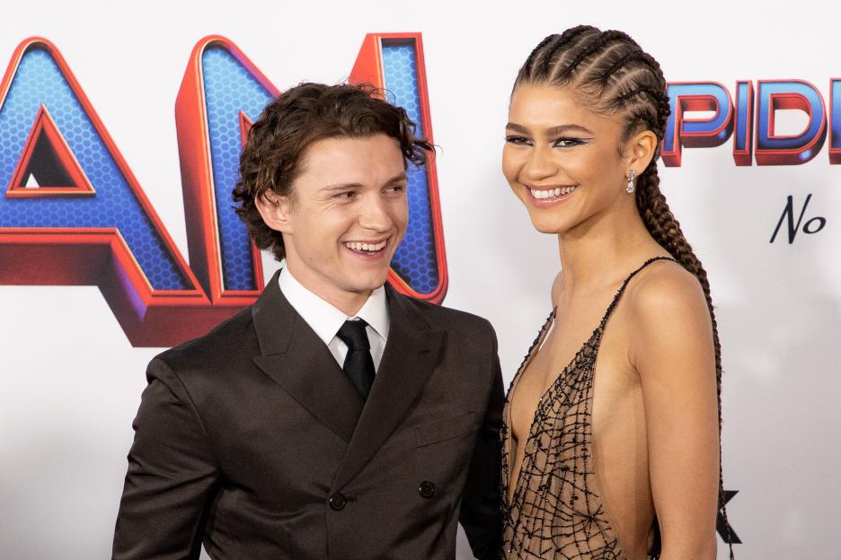 Tom Holland and Zendaya smiling at the Los Angeles premiere of "Spider-Man: No Way Home."