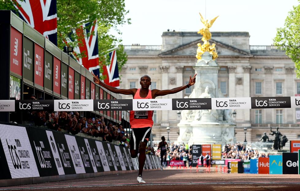 Kenya's Sabastian Sawe crosses the London Marathon finish line to win the men's elite race.
