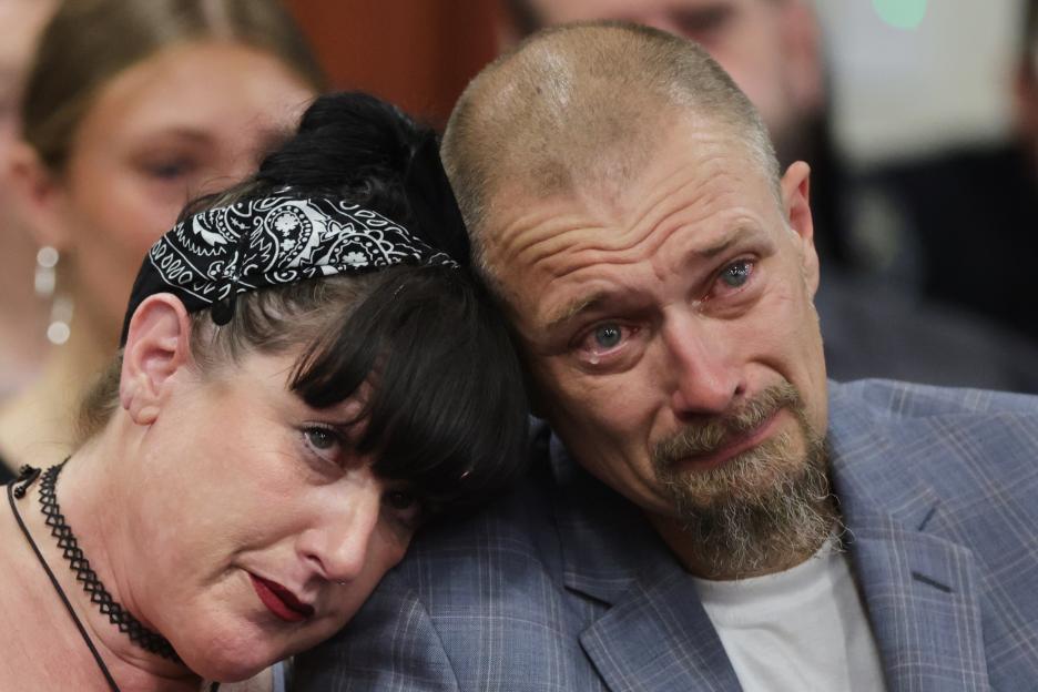 Benjamin Mogen, father of Madison Mogen, cries as a woman leans her head on his shoulder during a sentencing hearing.