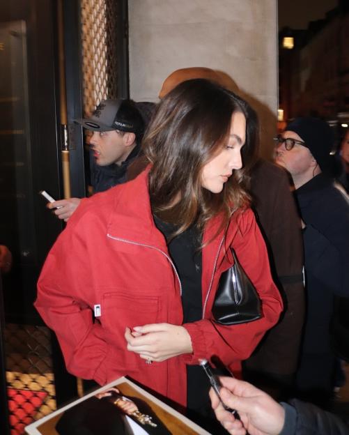 Vittoria Ceretti signing autographs for fans.