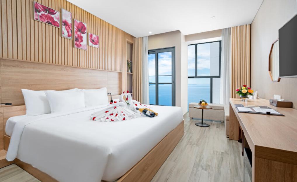 Bedroom at Emerald Bay Hotel & Spa Nha Trang with an ocean view.