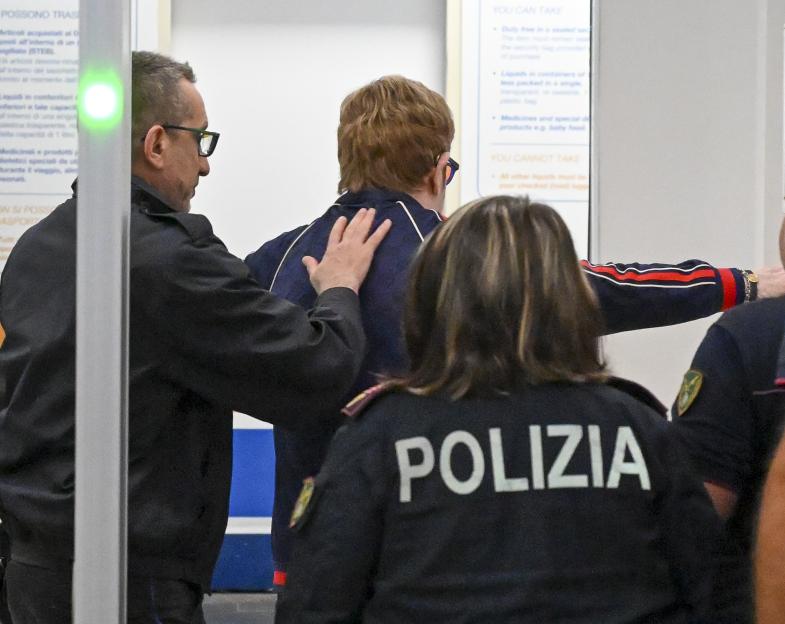 Elton John, 79, Navigates Airport Security After Performing at Dua Lipa's Wedding