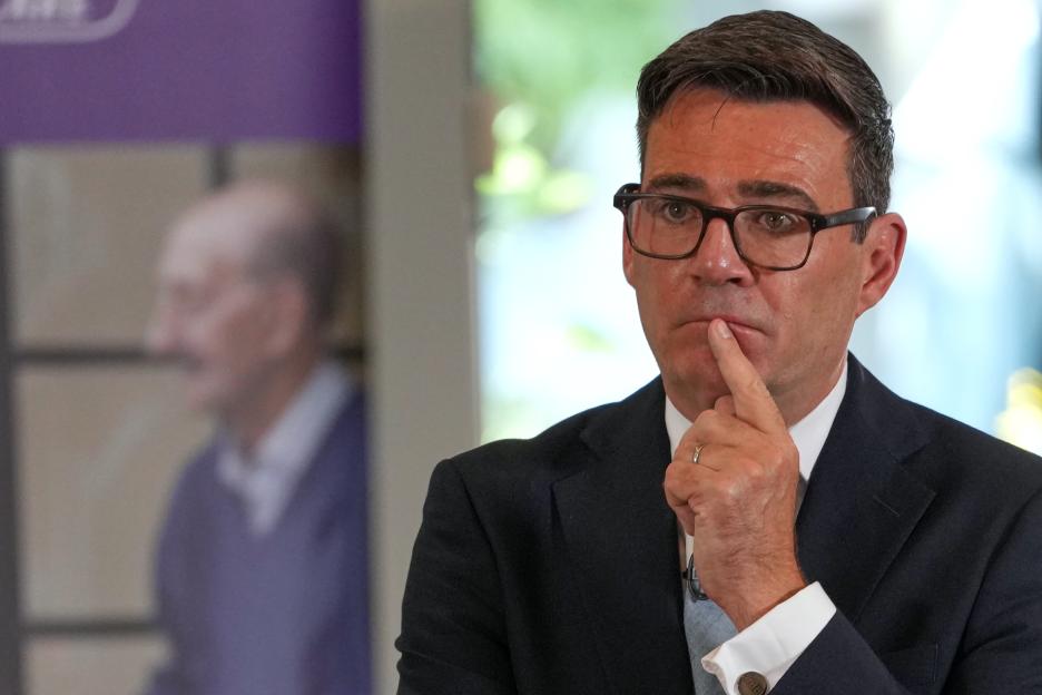 Britain's Prime Minister Andy Burnham pauses during a care home visit.