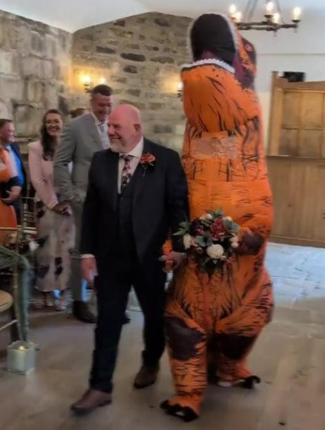 I Stunned Everyone at My Wedding by Walking Down the Aisle in a Dinosaur Costume Instead of a Dress!