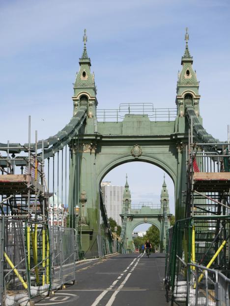 Hammersmith Bridge closed for refurbishment with scaffolding, allowing bicycles and walkers only.