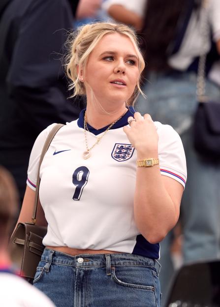 Kate Goodland, wife of Harry Kane, in the stands during a UEFA Euro 2024 match, wearing an England jersey with the number 9.