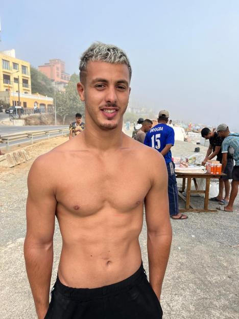 Rayame Boutalia, a migrant in the Ceuta refugee camp, smiles at the camera.