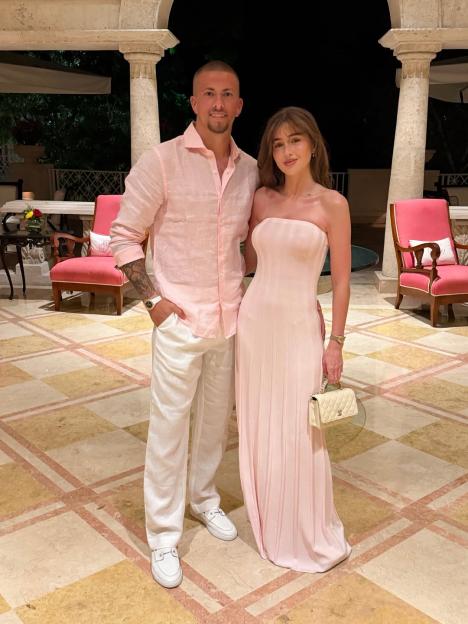 Georgia Steel and her fiancé enjoying a sun-soaked holiday.