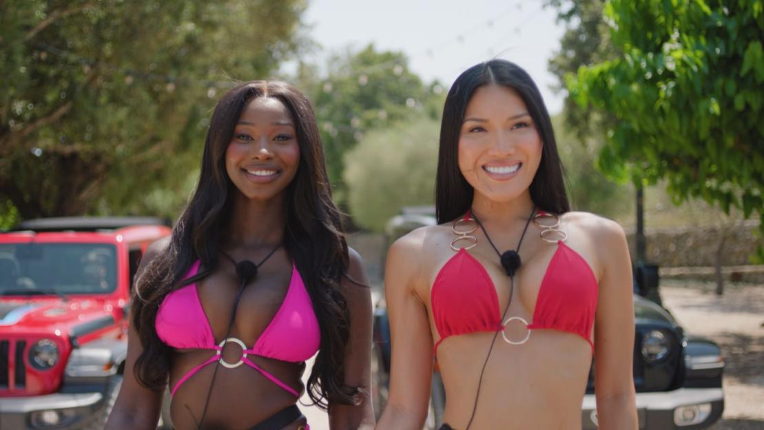 Alima Gagigo and Sophie Lee smiling in bikinis on the set of 'Love Island'.