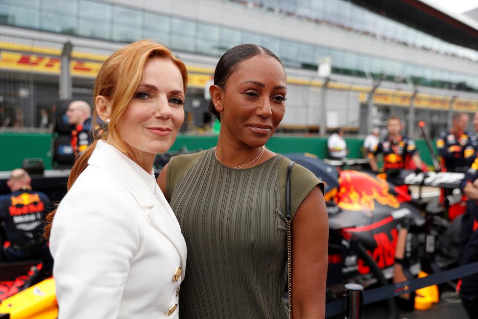 Geri Halliwell and Mel B pose for a photo before the British Grand Prix.