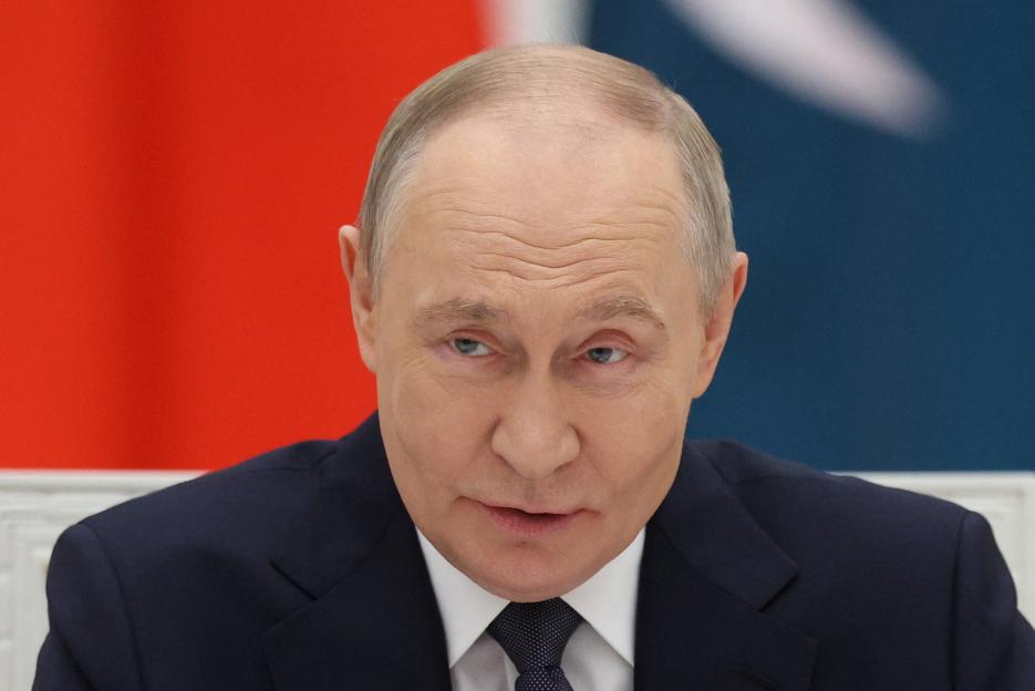 Russian President Vladimir Putin speaking during a meeting.