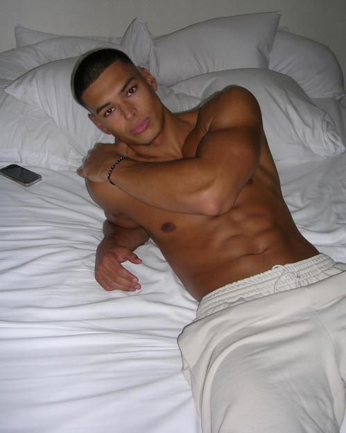 Model and Twitch streamer Marlon Lundgren Garcia lying on a bed.