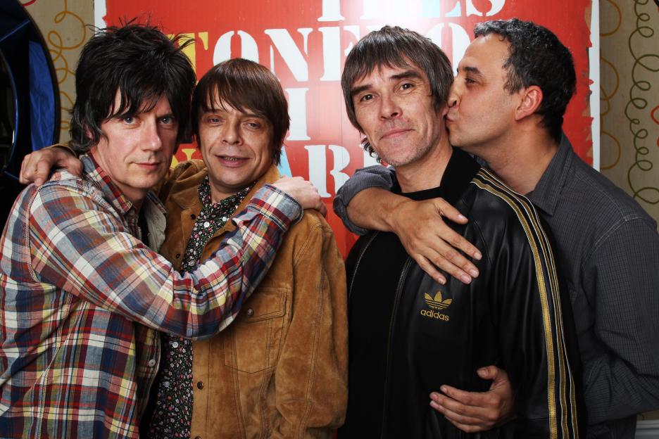 The Stone Roses members John Squire, Mani, Ian Brown, and Reni posing for a portrait.