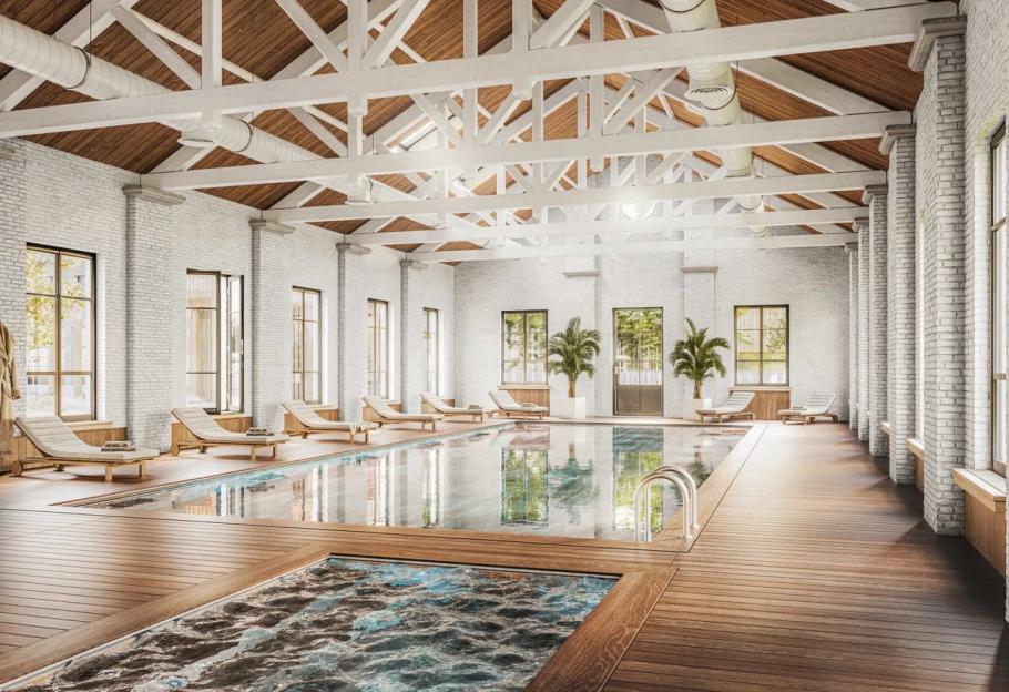 Illustration of an indoor swimming pool with lounge chairs and wooden decking at the Cabu Cotswolds resort.