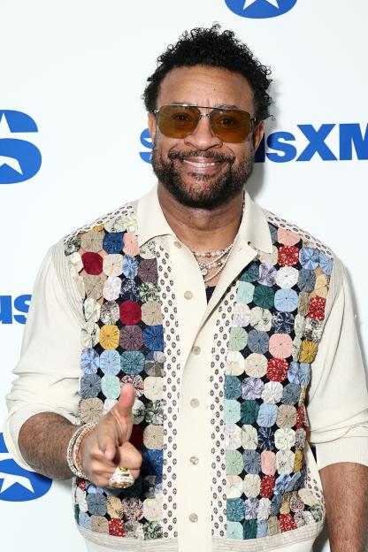 Shaggy smiling and pointing towards the camera at SiriusXM Studios.
