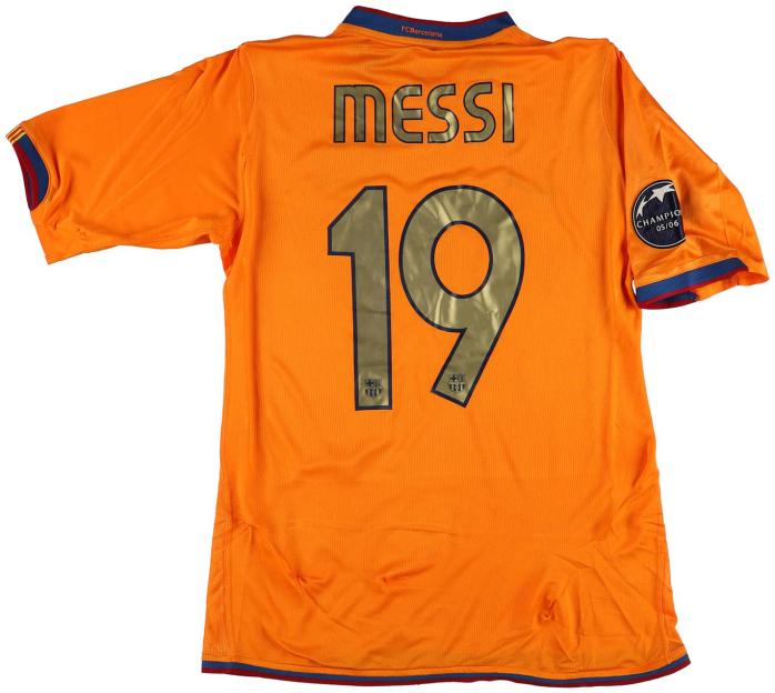 Lionel Messi's orange FC Barcelona shirt with number 19 and a Champions 05/06 patch.