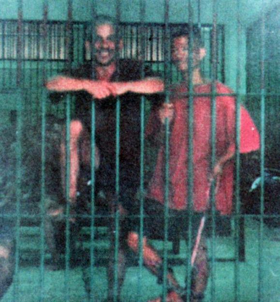 Jonathan Wheeler, a convicted drug smuggler, and another man behind bars in a Thai prison.