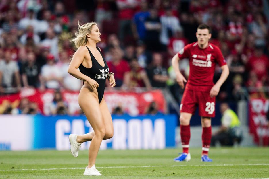 Kinsey Wolanski streaking in a black swimsuit during the UEFA Champions League Final.