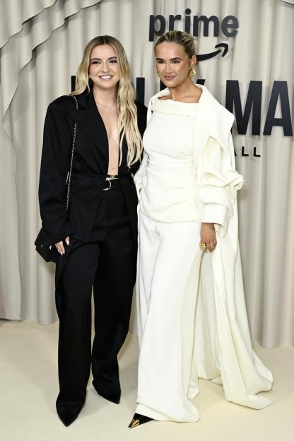 Zoe Hague and Molly-Mae Hague posing on a red carpet.