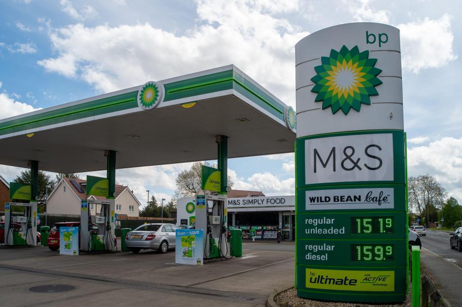 A BP petrol station with a sign showing current fuel prices: regular unleaded at 151.9 and regular diesel at 159.9.