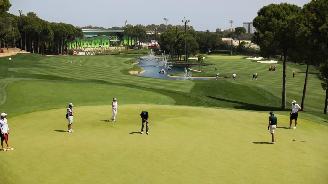 Golfers on the green at Carya Golf Club.
