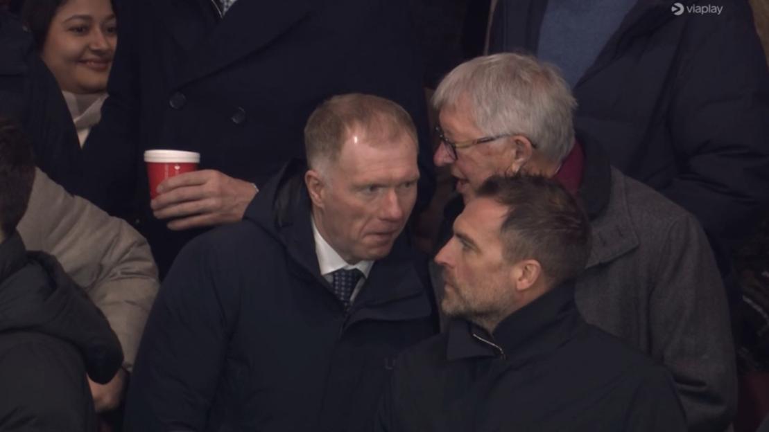 Ferguson and Scholes watching a football match.