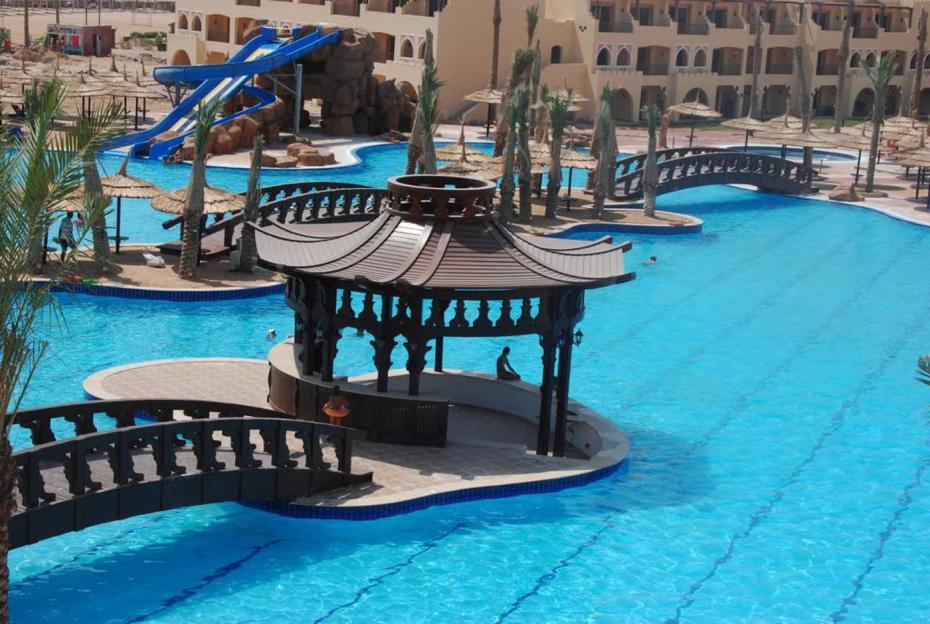 Edge by Rotana Sea Beach resort with a swimming pool, bridges, gazebos, and water slides.