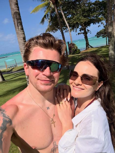 Adam Peaty and Holly Ramsay on honeymoon at a tropical beach.