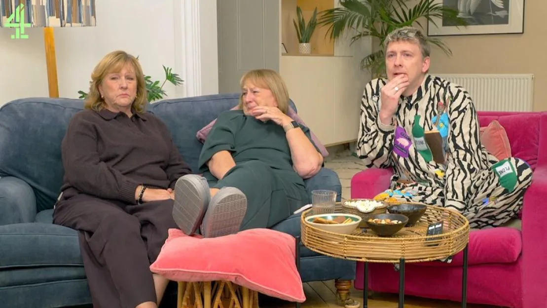 Gogglebox cast members looking emotional on a sofa.