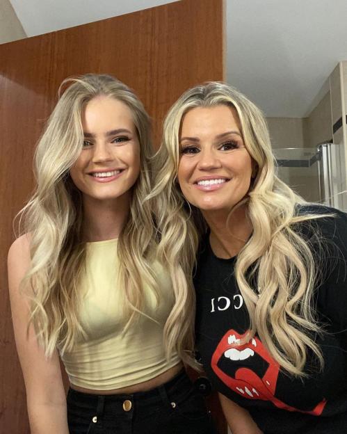 Kerry Katona and her daughter Lilly smiling at the camera.