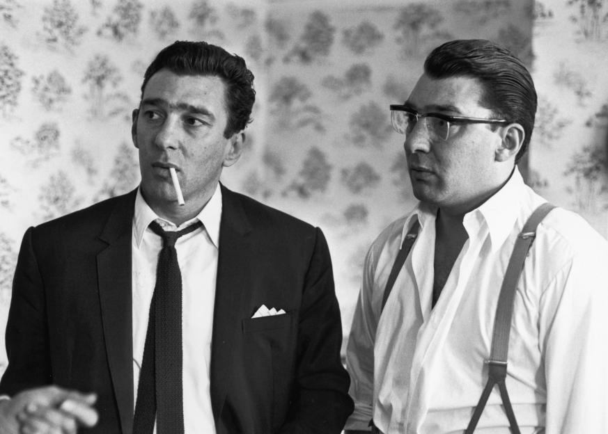 Ronnie (right) and Reggie Kray, twin brothers and gangsters, are pictured together after being questioned by police regarding a murder.