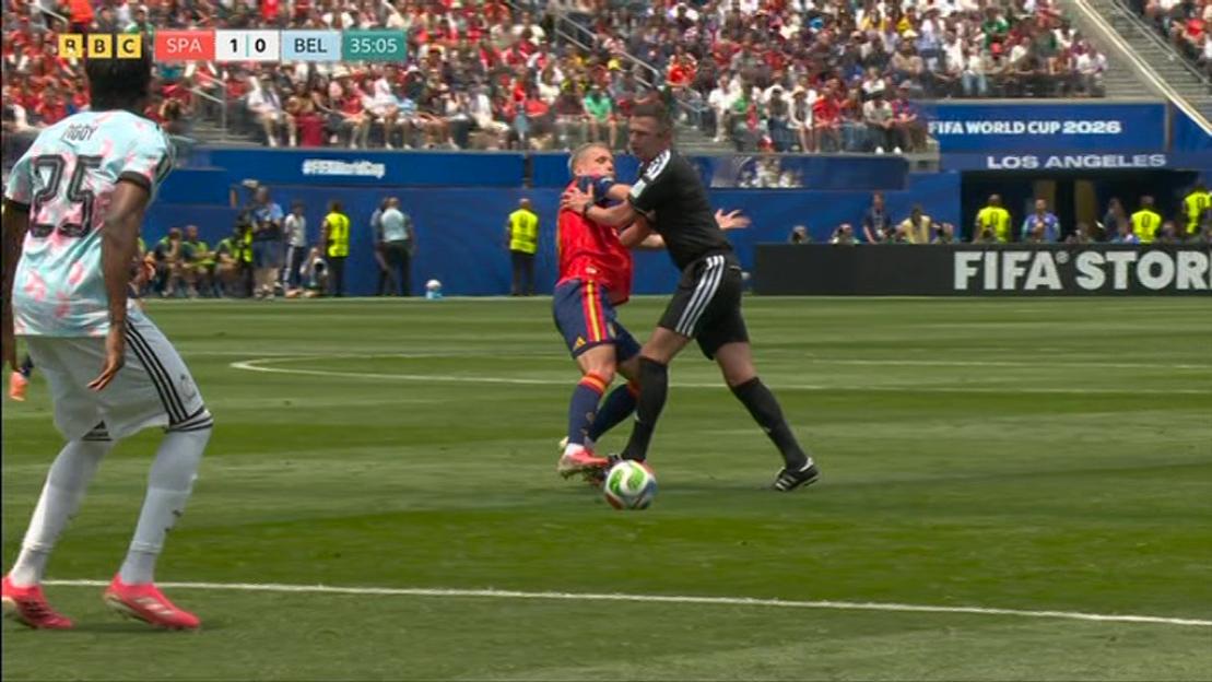 Referee Michael Oliver Accidentally Clotheslines Spain Star, Fans Quip He’s “Defending Better Than Belgium”