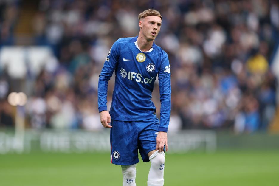 Cole Palmer in a blue Chelsea jersey and shorts during a match.