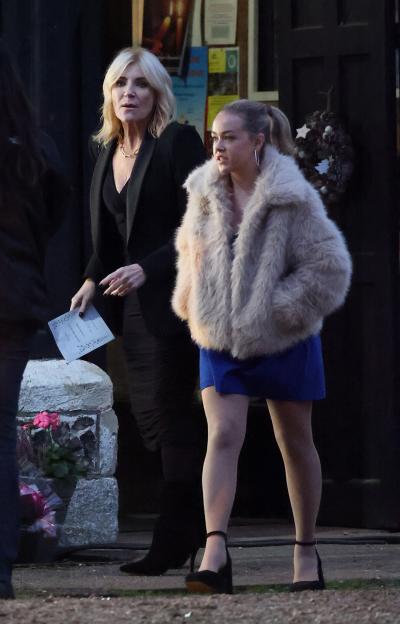 Cindy Beale and another woman leaving a church.