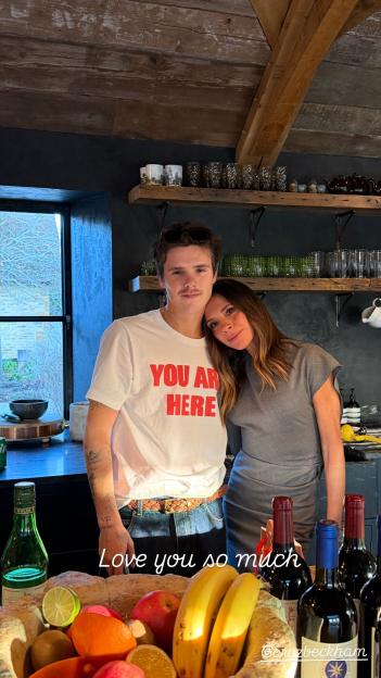 Brooklyn Beckham and Victoria Beckham in a kitchen.