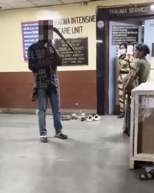 VIDEO: Man calmly waits in hospital with machete lodged in head