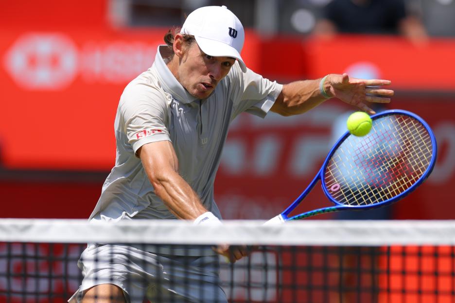 Alex de Minaur (AUS) playing tennis during the men's quarter-final match.