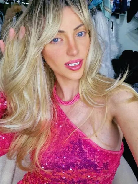 Influencer Barbara Jankavski, who underwent 27 cosmetic surgeries to look like Barbie, wearing a pink sequined dress.