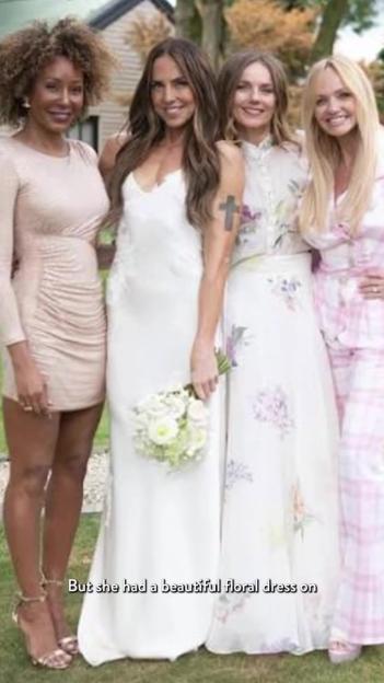 Four women dressed in formal attire, standing in a garden setting.