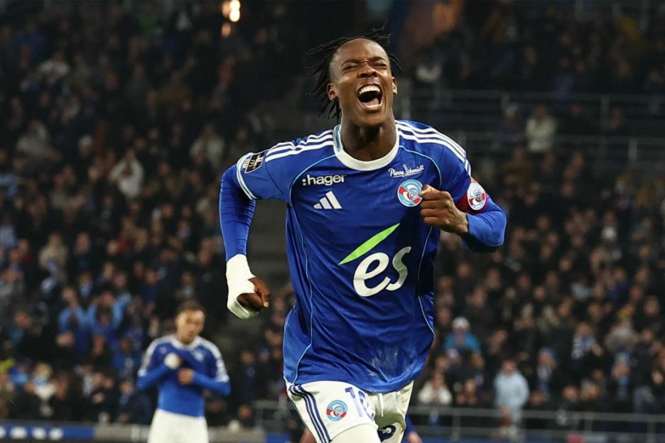 Footballer Habib Diallo celebrating after scoring a goal for Strasbourg against Lille.