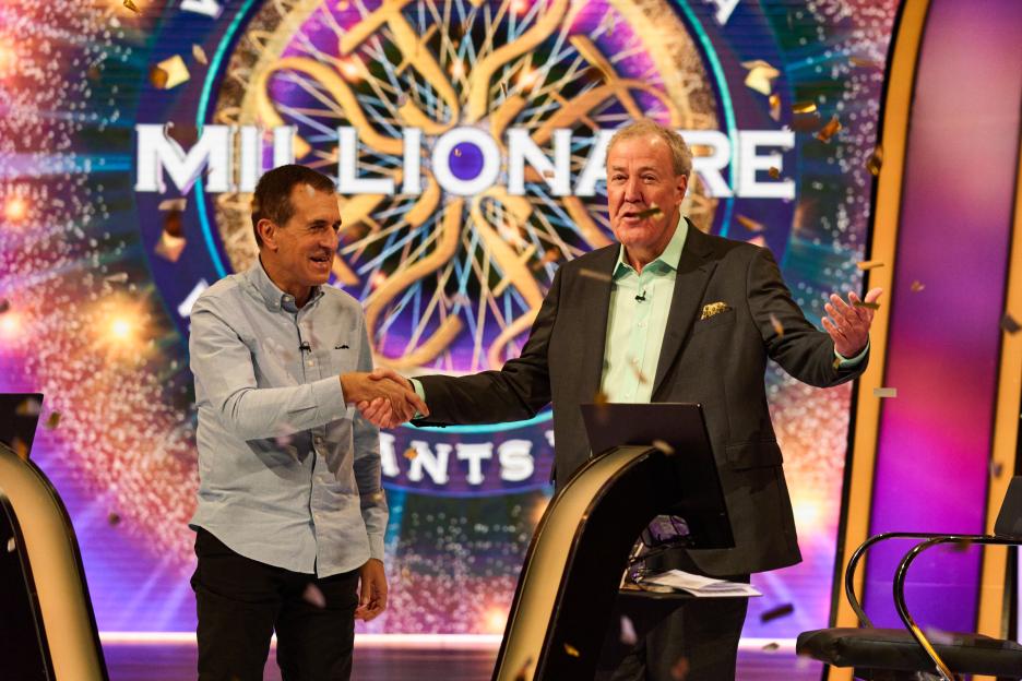 Roman Dubowski shakes hands with Jeremy Clarkson on the set of "Who Wants To Be A Millionaire".