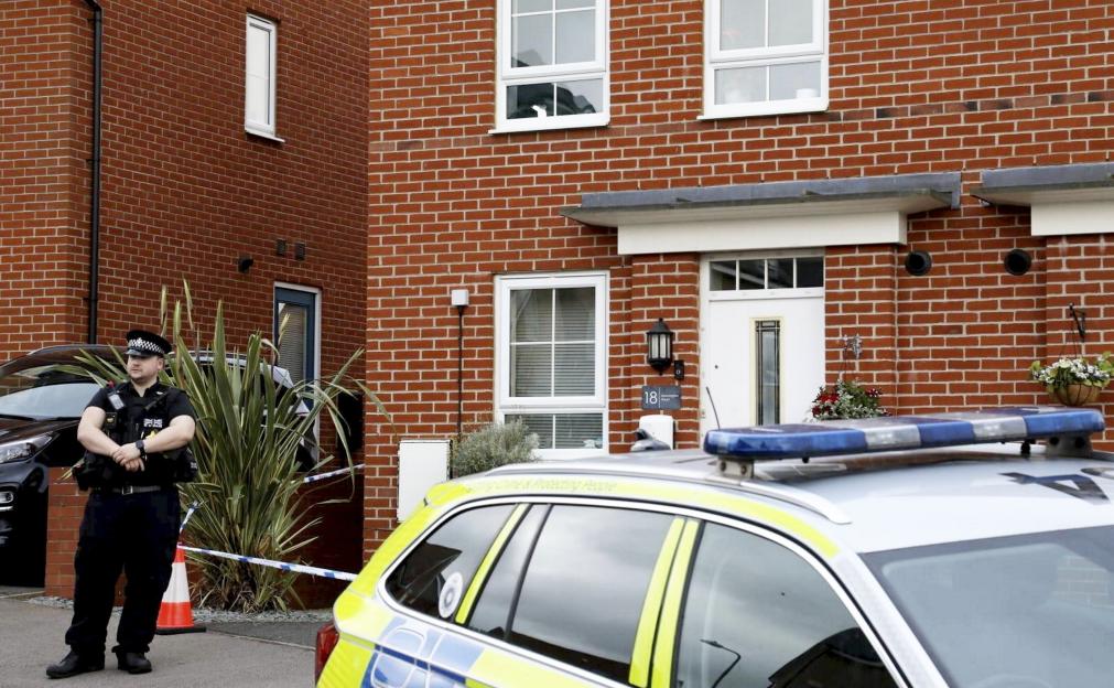 Police stand outside the house in Donnington Road, Burton Latimer, where Isobella Knight was murdered.