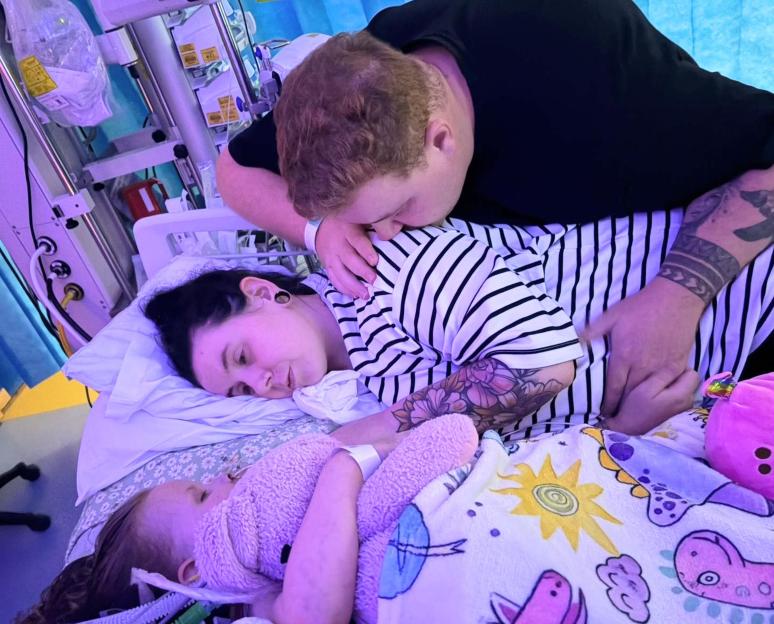 Parents Tom Dunn and Courtney Sherwood comfort their daughter Penny Dunn in the hospital.