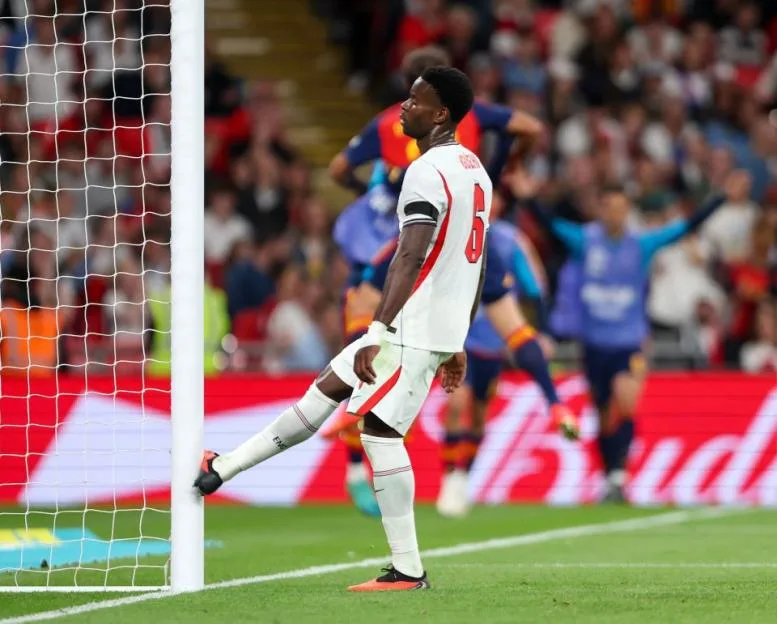 England player Marc Guehi taps the goalpost during a match against Spain.