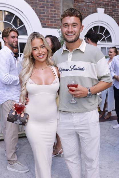 Ellie Chadwick and Finley Maddock attending the Oh Polly The Italian Piazza Summer Party.