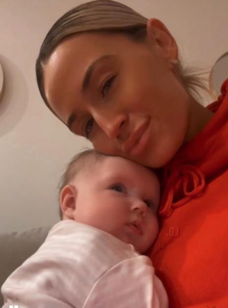 Paula Edgar holding her baby, Pixie.