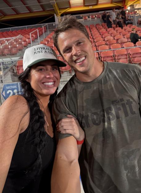 Madison and Kyle Loftin smiling at a stadium.