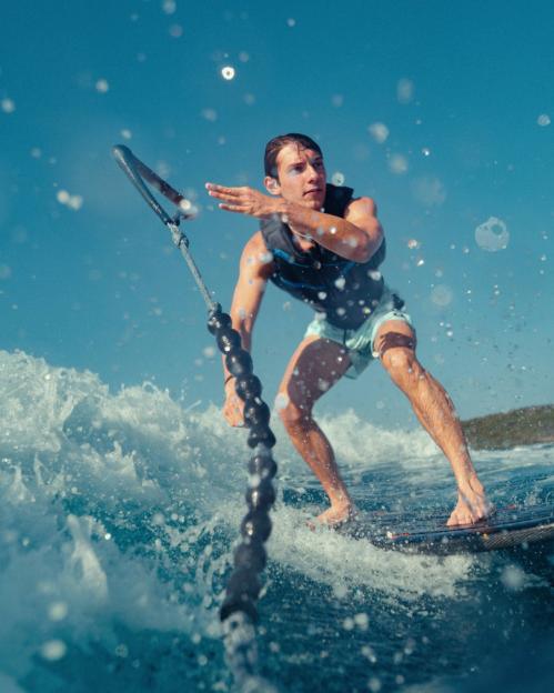 A man wakeboarding across the water.