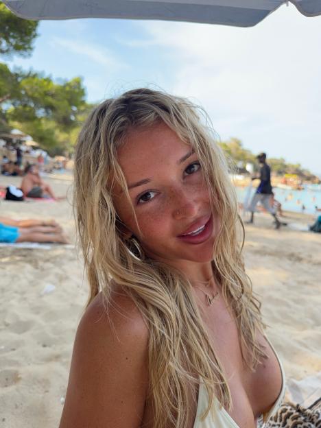 Charleen Murphy on a beach wearing a bikini.